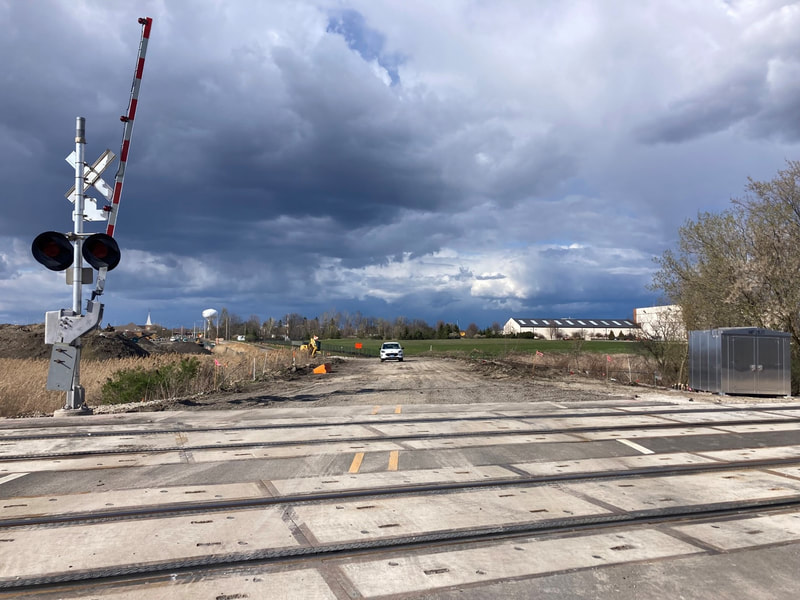 Looking north from the railroad tracks; pavement removal completed to the Airport Access Road