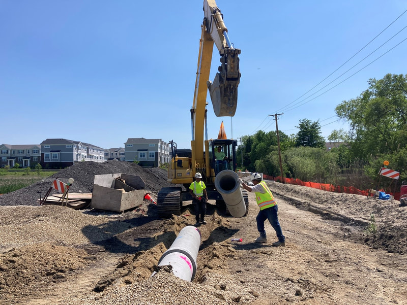 This new storm sewer line will be covered by several feet of fill as we raise the roadway elevation south of the railroad tracks