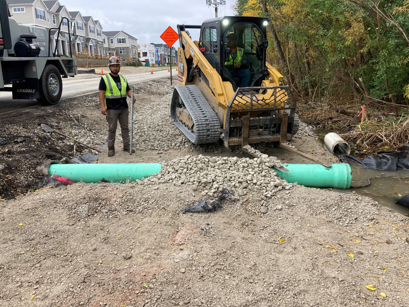 Extending the stormwater drainage pipe under the west side working platform